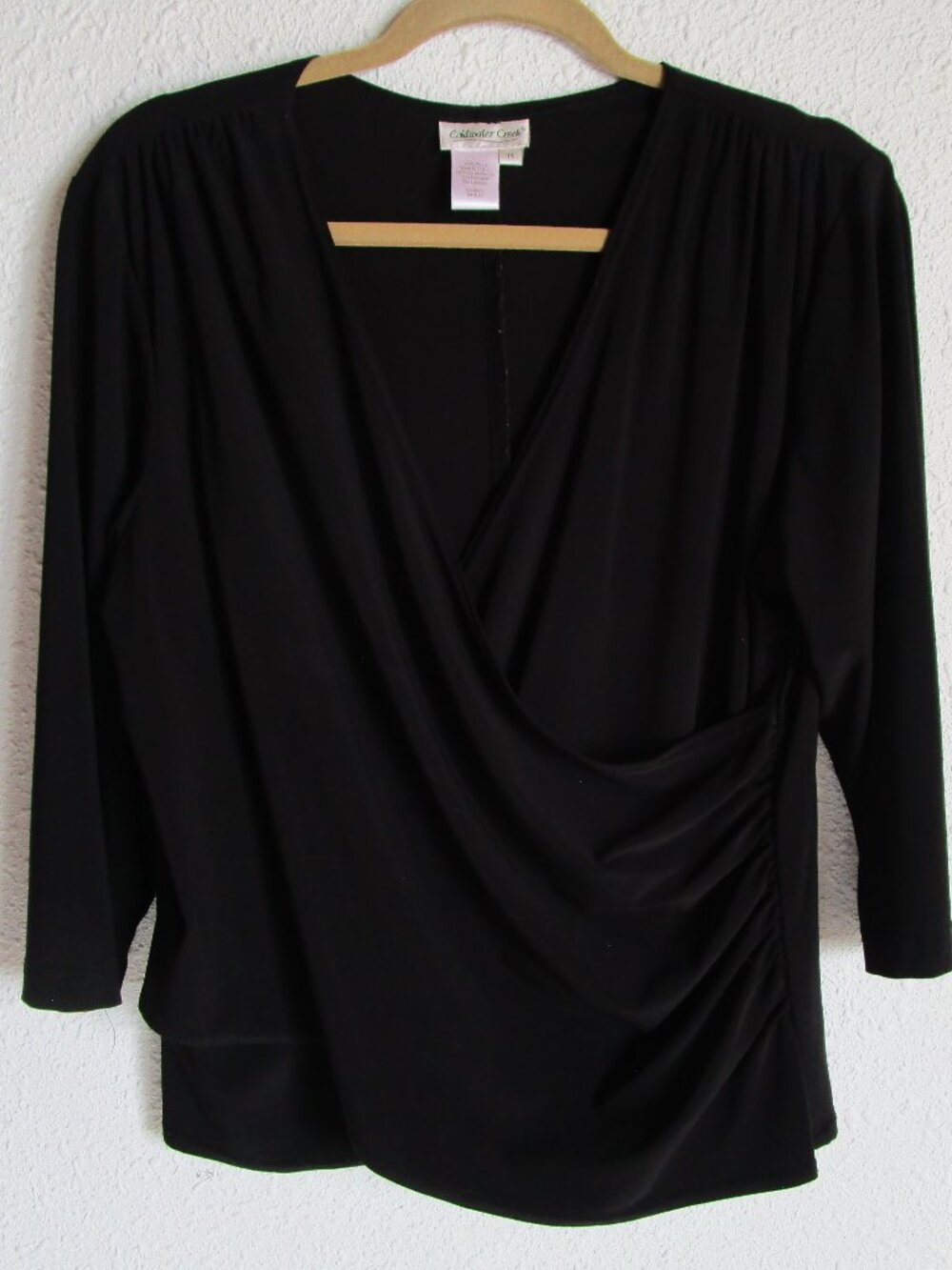 Black wrap around top, 1X Coldwater Creek, midlength sleeve. Gently used.